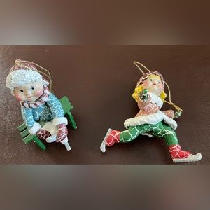Pair of kids ice skating ornaments.